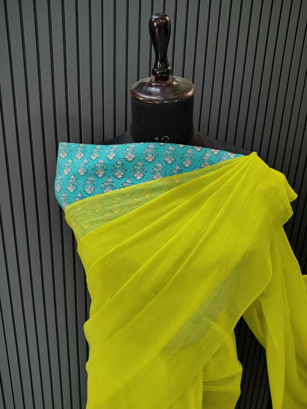 Yellow fabric with blue border on a black background